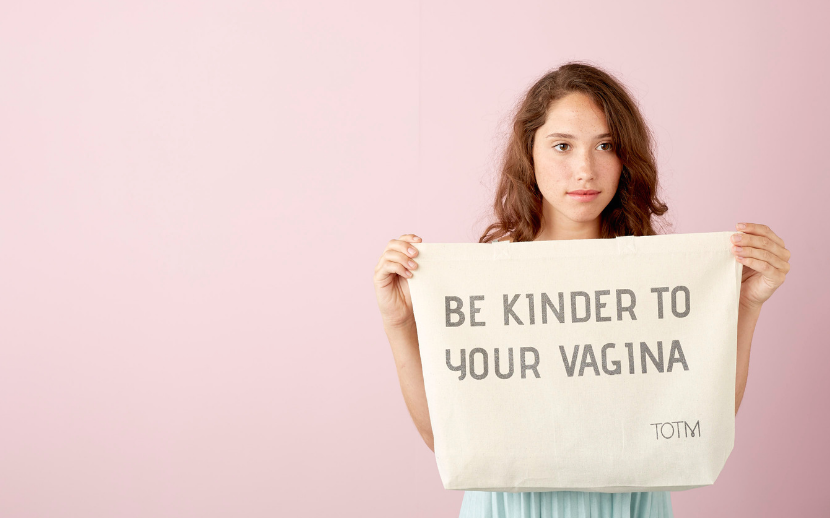 Model holding 'Be Kinder to Your Vagina' tote bag
