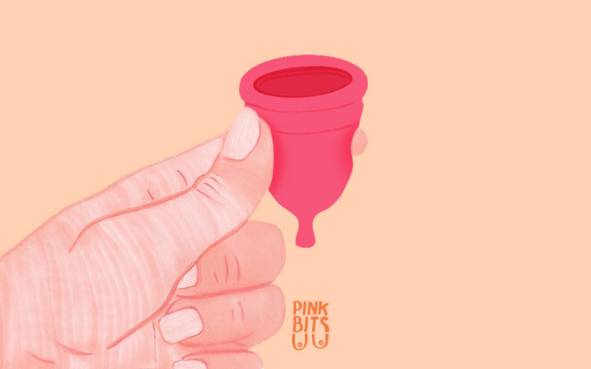 Illustration of hand holding a menstrual cup