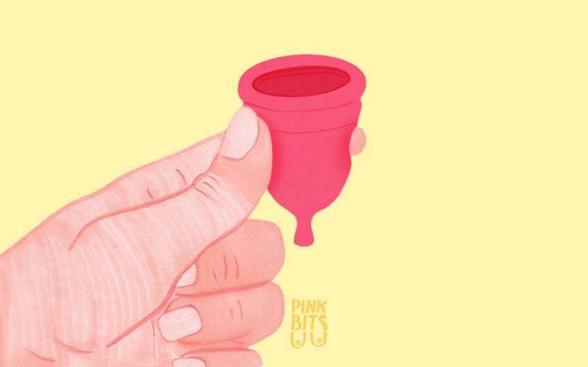 Illustration of hand holding menstrual cup