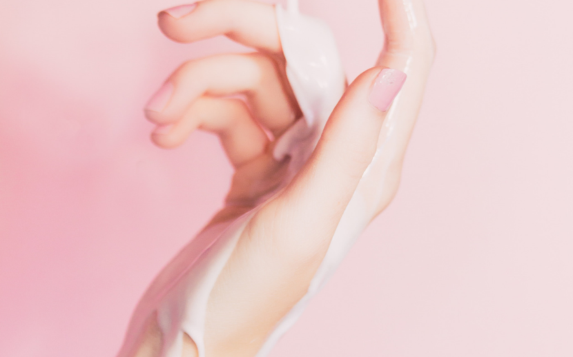 closeup of hand covered in moisturiser clean beauty treatment
